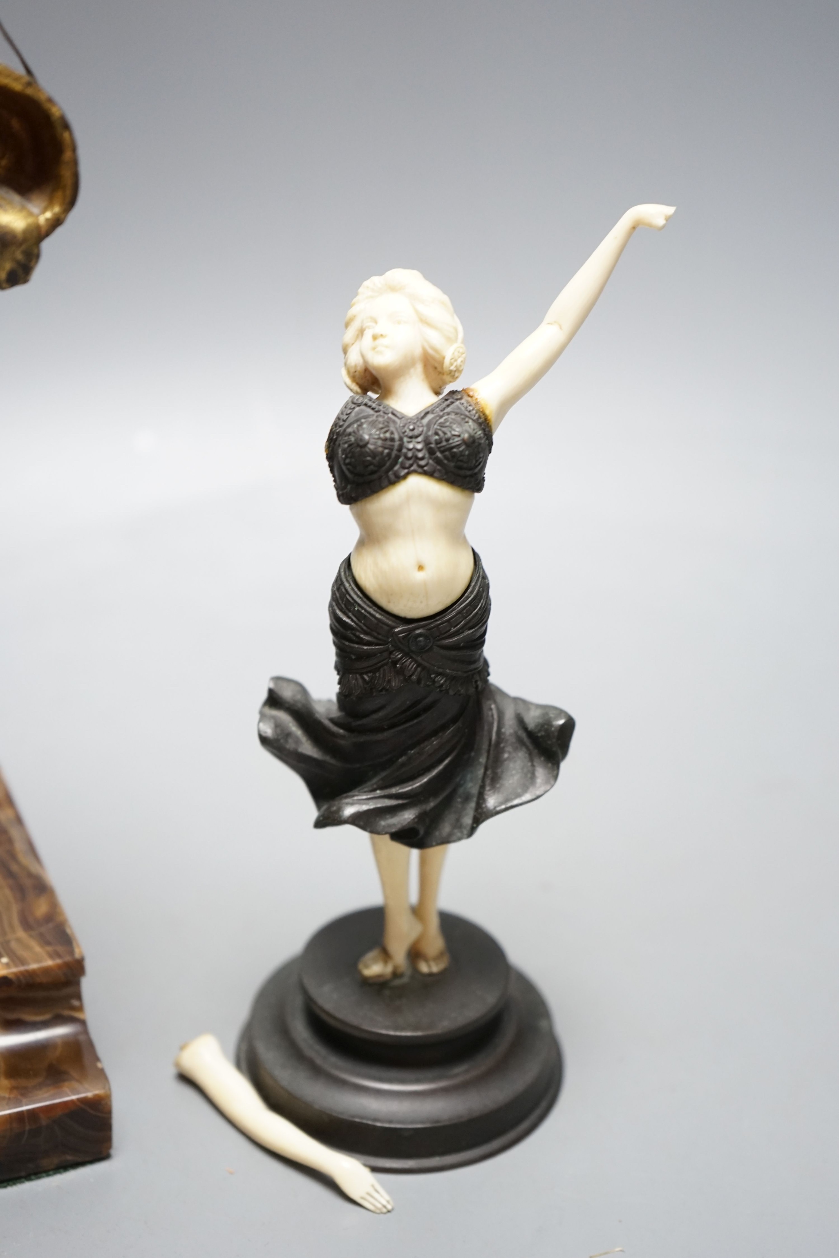 Georges Van Der Straeten, Belgian 1856-1928, An Art Deco bronze and ivory figure of a girl reading a book together with a smaller bronze and ivory figure, Tallest 31.5 cms high.